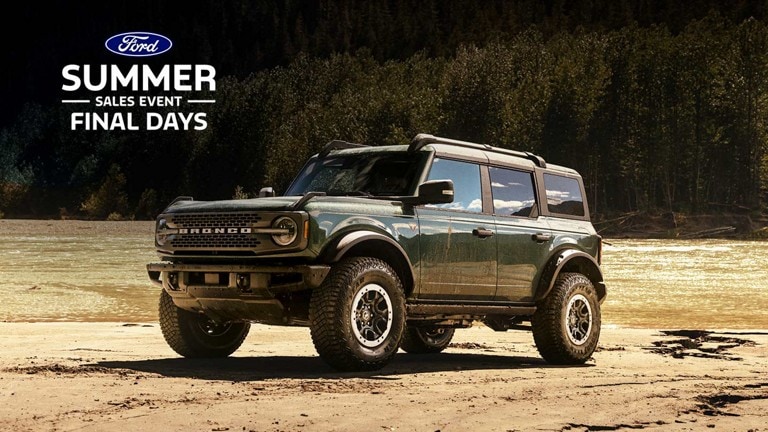 A 2024 Ford Bronco® Badlands® SUV parked near a forest stream