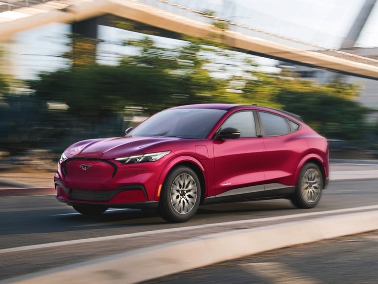 2025 Ford Mustang Mach-E® being driven down a city street