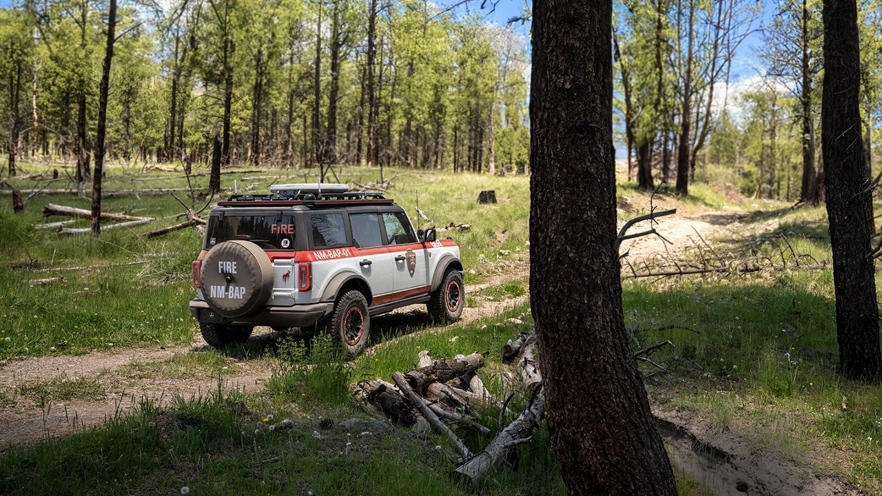 Bronco® Badlands® model with the Sasquatch® Off-Road Package being driven on a two-track dirt road