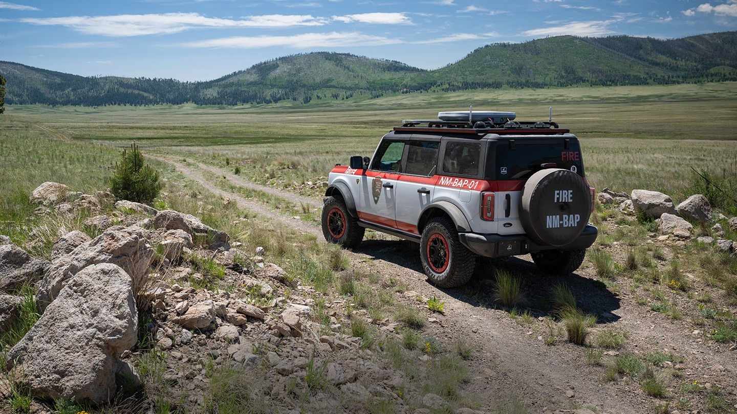Bronco® Badlands® model with the Sasquatch® Off-Road Package being driven on a two-track dirt road