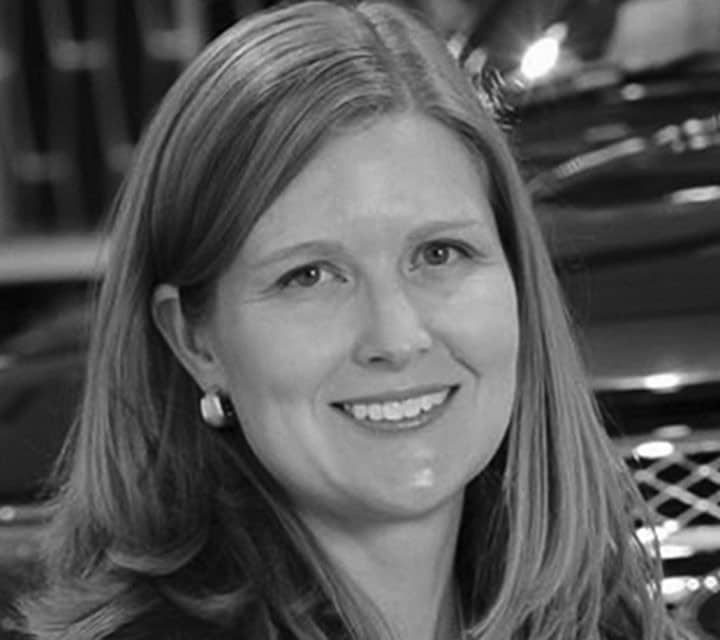A close-up black and white portrait of Jackie Marshall DiMarco, a woman innovator at Ford. Rollover of the photo enlarges her photo slightly. Clicking her photo takes you to her professional bio.