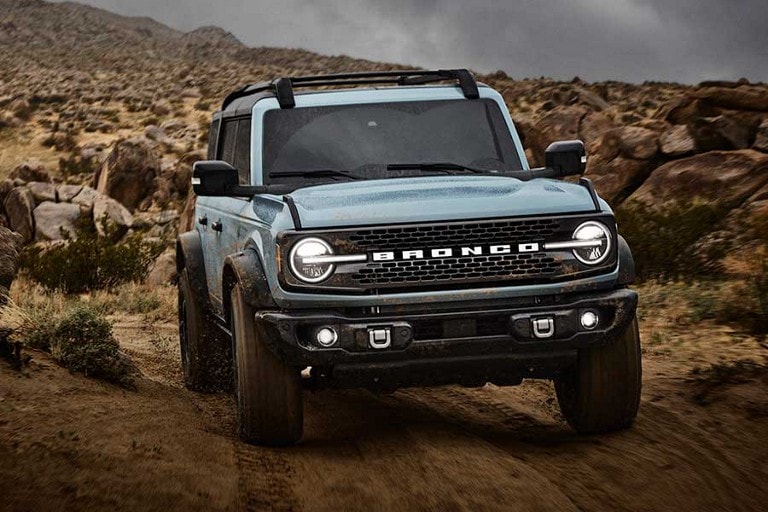 2026 Ford Bronco® Badlands® driving through dirt terrain