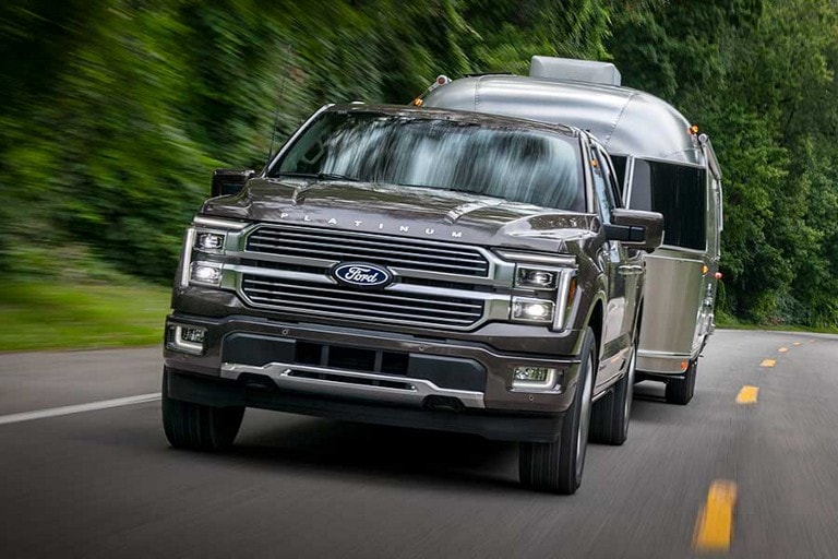 2026 Ford F-150® hauling an airstream while driving down road