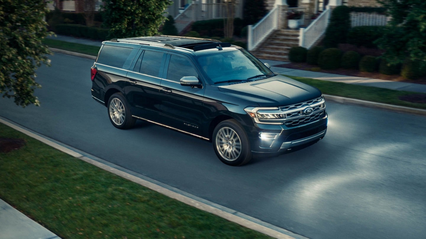 A 2024 Expedition being driven through a residential neighborhood.