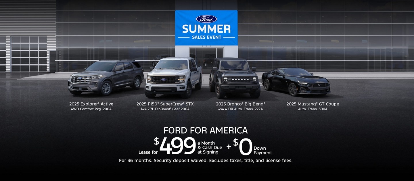 A lineup of Ford vehicles in front of a Ford dealership that displays a Ford Summer Sales Event banner