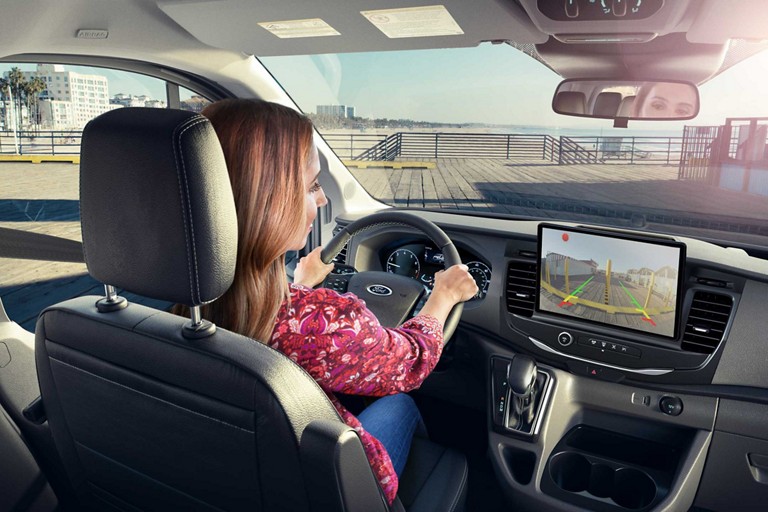 A driver using the 2026 Ford Transit® rearview camera