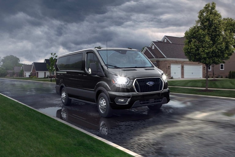 A 2026 Ford Transit® van being driven on a highway